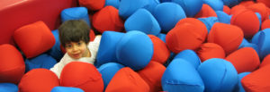 A pile of red and blue pillows sitting next to each other.